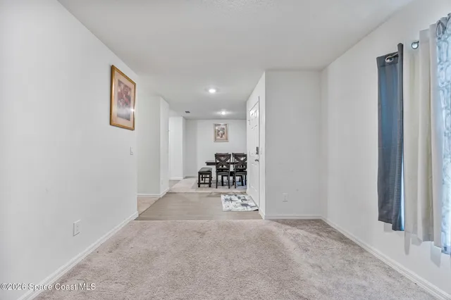 a view of a livingroom with a flat screen tv
