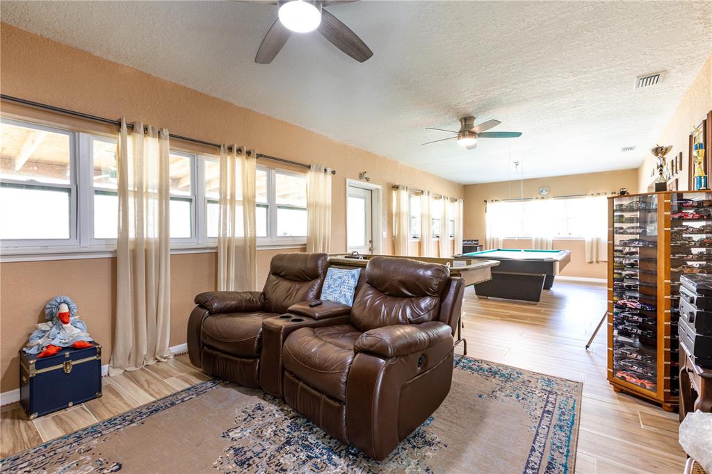 402 Southeast 709th Street Old Town, FL 32680 - Photo 11 of 37 a living room with furniture and a large window