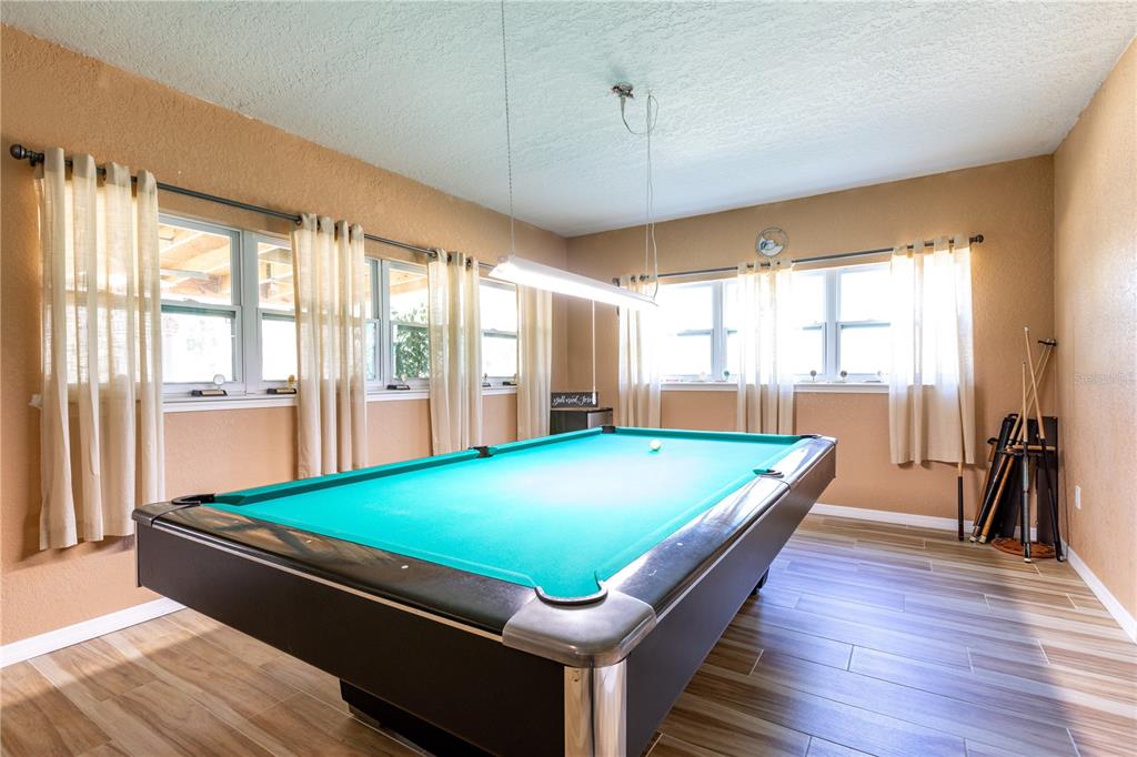 402 Southeast 709th Street Old Town, FL 32680 - Photo 13 of 37 a room with pool table and windows