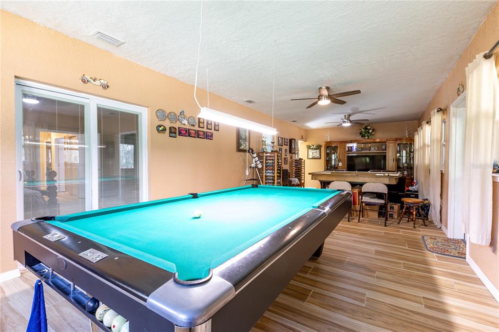 402 Southeast 709th Street Old Town, FL 32680 - Photo 14 of 37 a room with pool table and windows