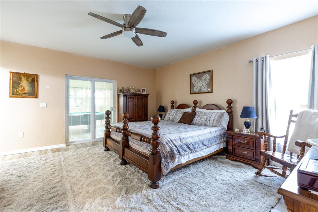 402 Southeast 709th Street Old Town, FL 32680 - Photo 15 of 37 a bedroom with a bed and a large window