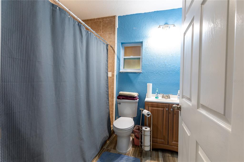 402 Southeast 709th Street Old Town, FL 32680 - Photo 26 of 37 a bathroom with a toilet and a sink