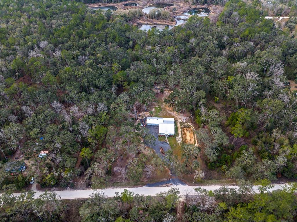 402 Southeast 709th Street Old Town, FL 32680 - Photo 37 of 37 an aerial view of a house with a yard and large tree