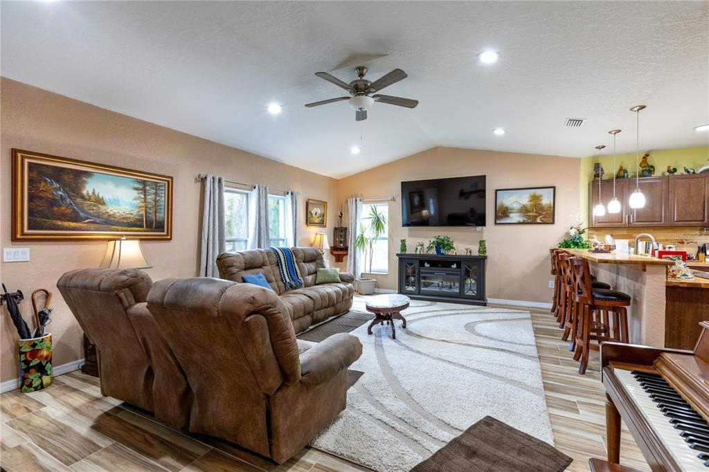 402 Southeast 709th Street Old Town, FL 32680 - Photo 5 of 37 a living room with furniture and a flat screen tv