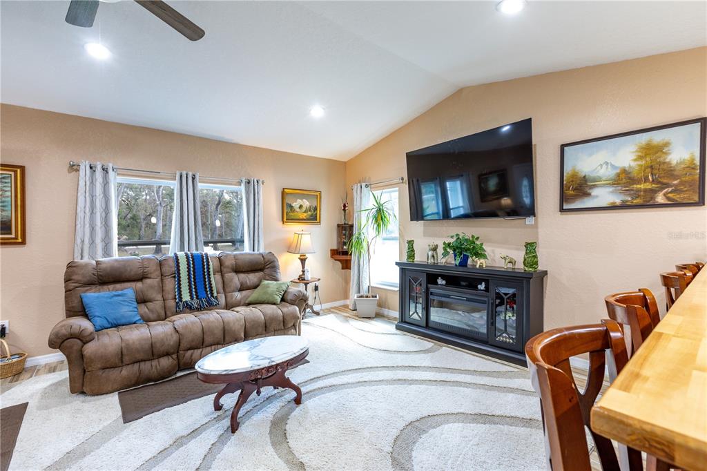 402 Southeast 709th Street Old Town, FL 32680 - Photo 6 of 37 a living room with furniture and a flat screen tv