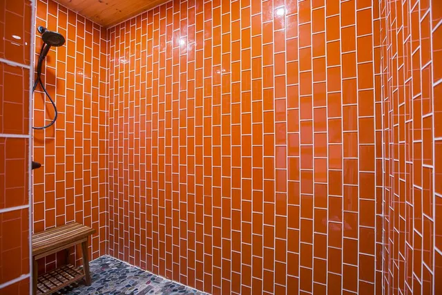 a bedroom with a bed and a view of walk in closet