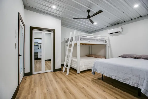 a bedroom with a bed and a window