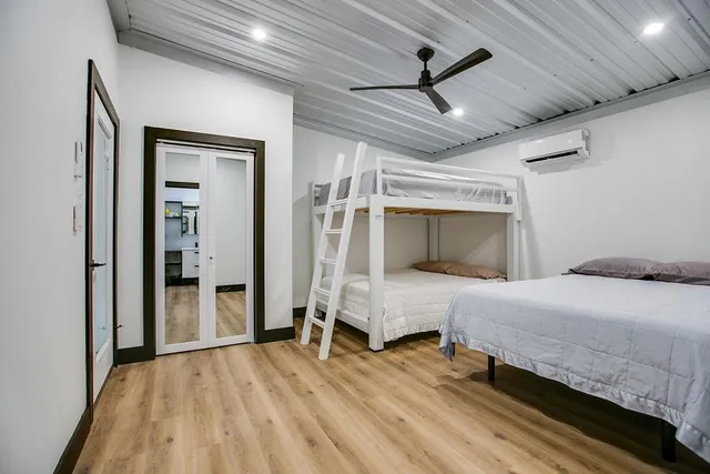 a bedroom with a bed and a window