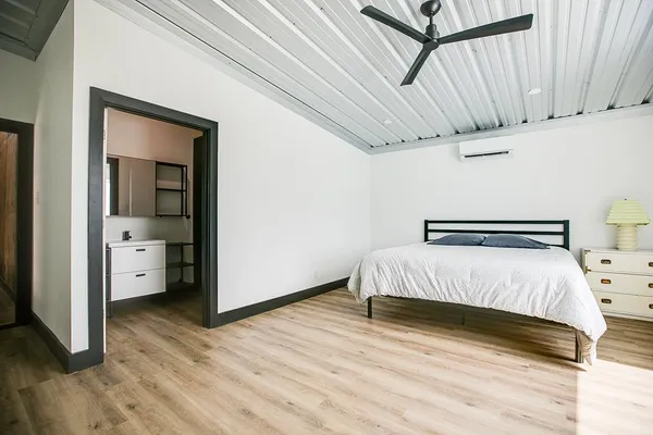 a view of entryway and hall with wooden floor