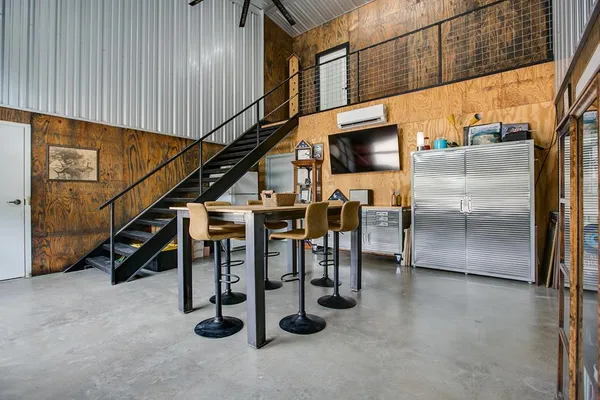 a kitchen with cabinets and stainless steel appliances