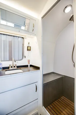 a kitchen with stainless steel appliances granite countertop a stove and a wooden cabinets