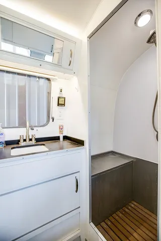 a kitchen with stainless steel appliances granite countertop a stove and a wooden cabinets