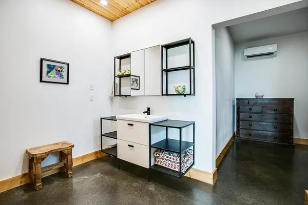 a bathroom with a sink toilet and blue shower