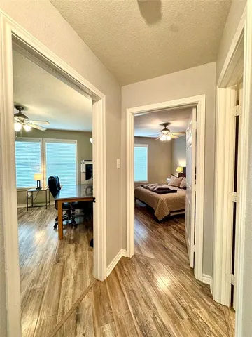 a view of a living room and a wooden floor