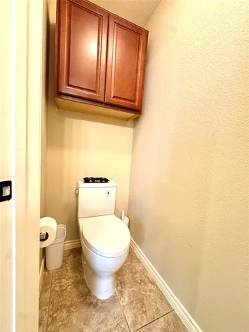 a bathroom with a toilet and a sink