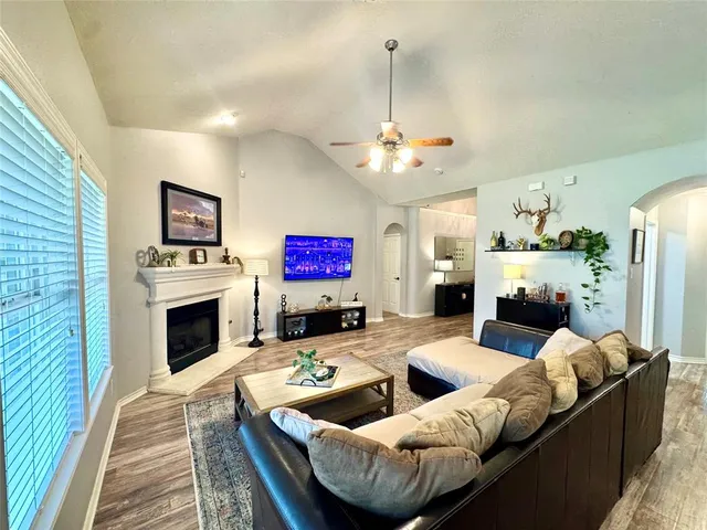 a living room with furniture and a fireplace