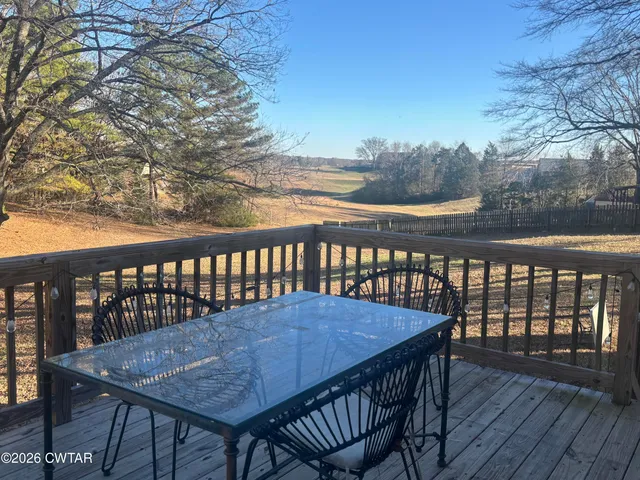 a view of a kitchen with wooden floor
