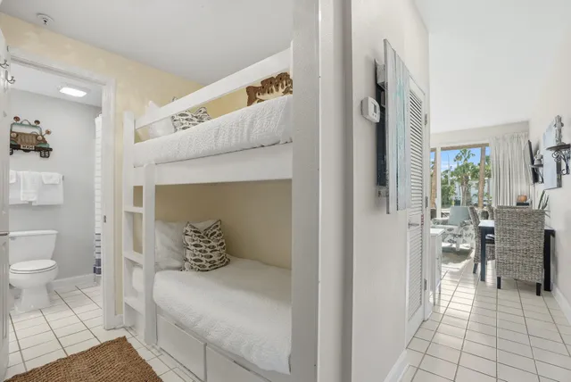 a room with furniture and a potted plant