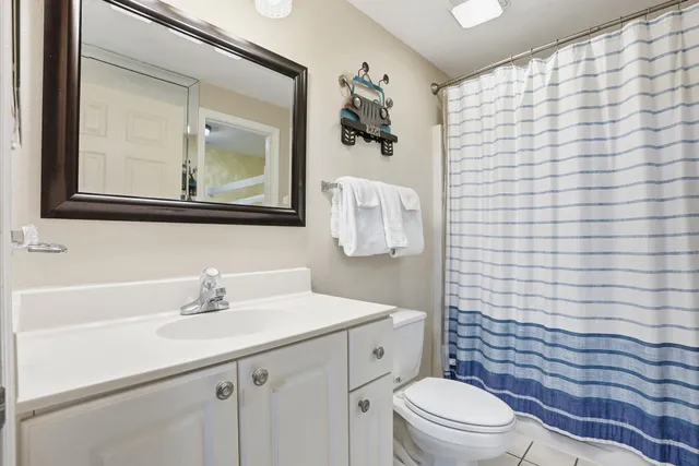 a view of a backyard with a table and chairs