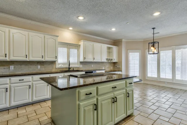 a view of a livingroom with a fireplace wooden floor and fire place