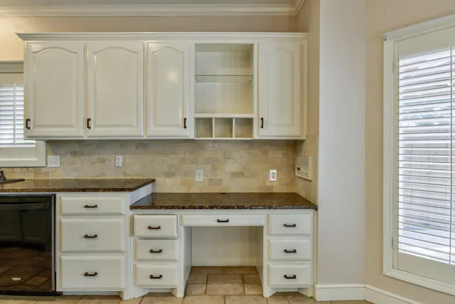 a bathroom with a mirror and a sink