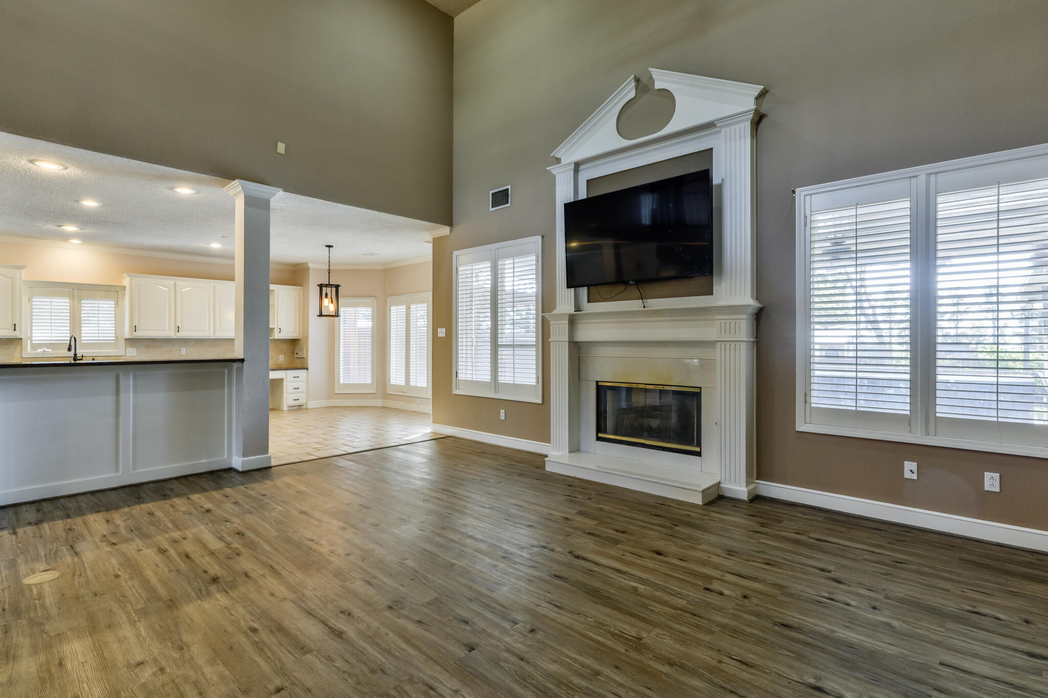 544 Highway 87 Wilson, TX 79381 - Photo 34 of 86 a view of a livingroom with a fireplace wooden floor and fire place