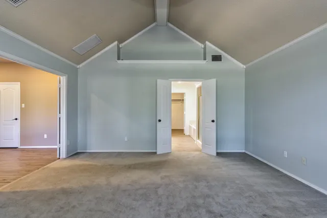 a view of a house with pool and sitting area