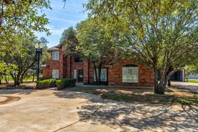 a view of a hallway with wooden door