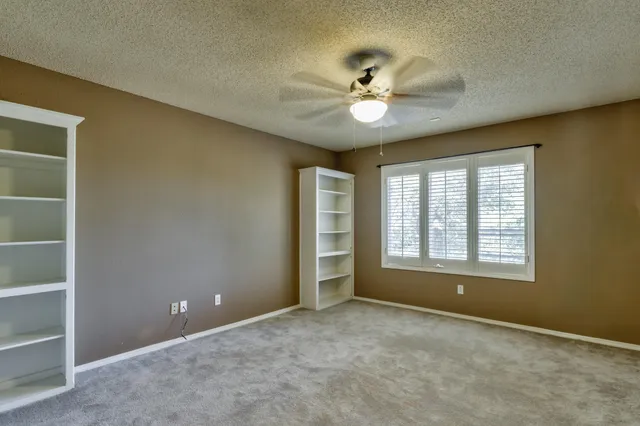a view of yard with swimming pool and green space