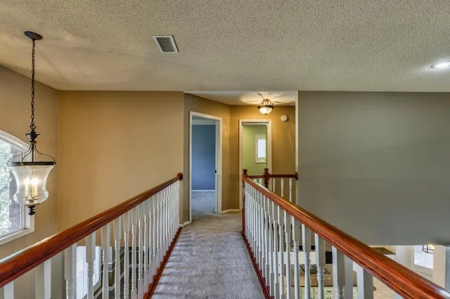 a view of a house with swimming pool and sitting area