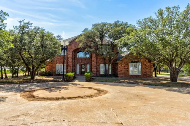 a view of a hallway with entryway door