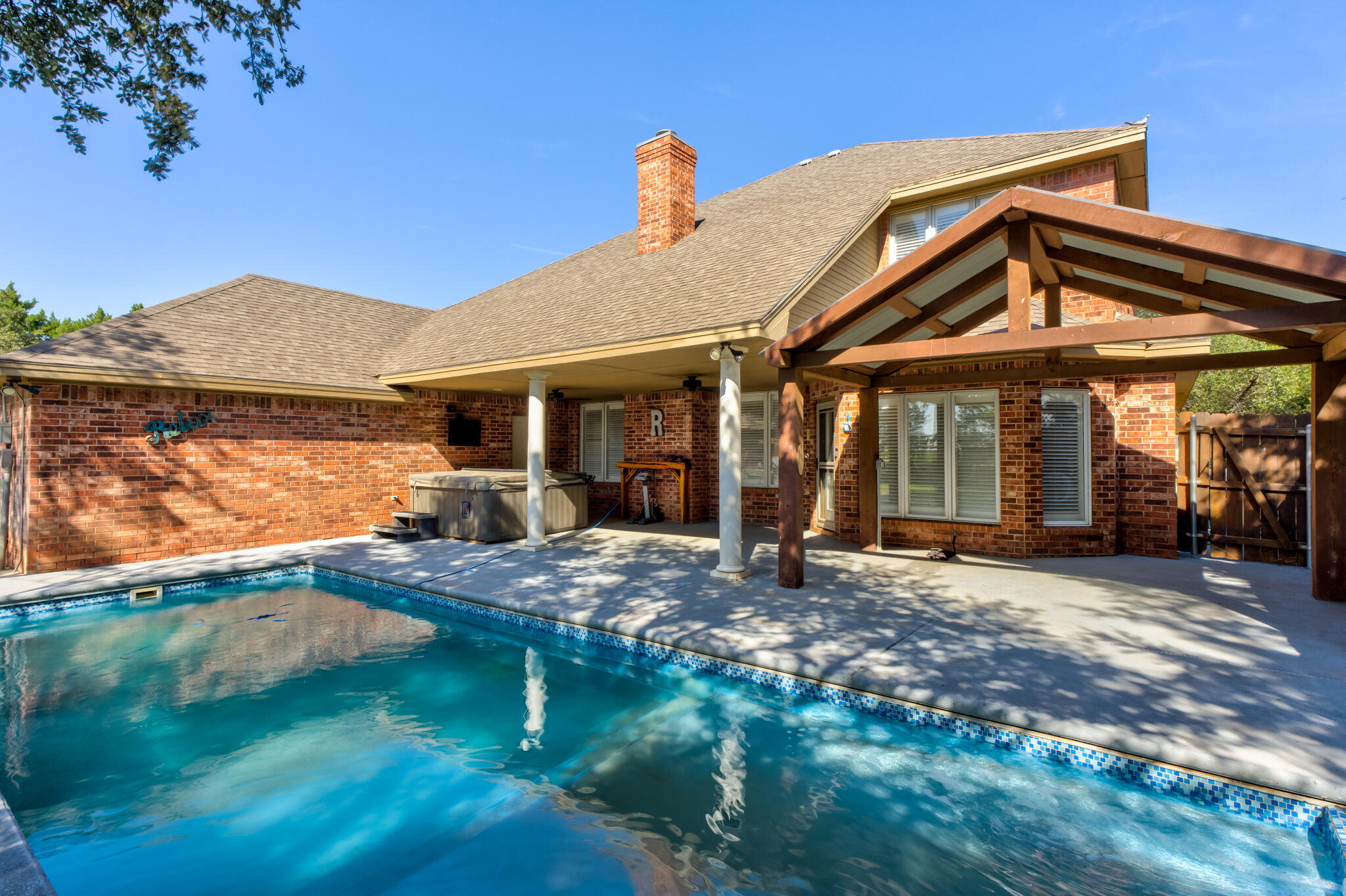 544 Highway 87 Wilson, TX 79381 - Photo 66 of 86 a view of a house with floor to ceiling windows and a yard