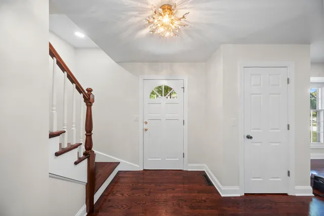 a view of an entryway with wooden floor