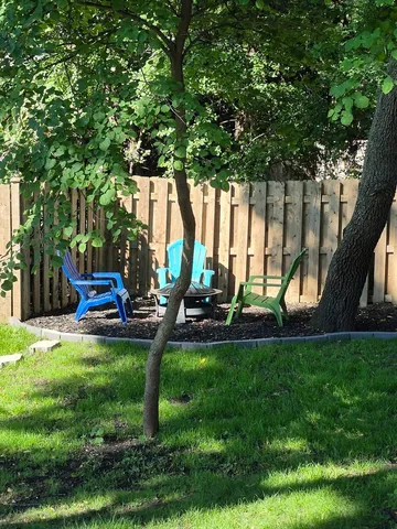 a view of a park with large trees