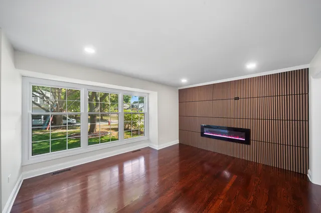 a view of outdoor space with wooden floor and windows