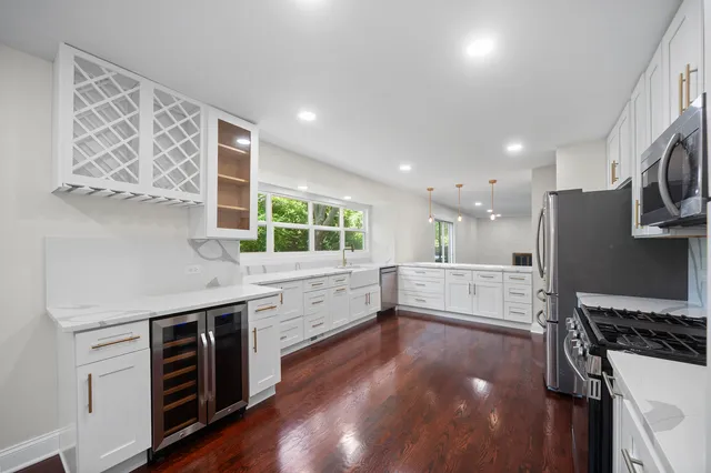 a kitchen with stainless steel appliances a stove and a refrigerator