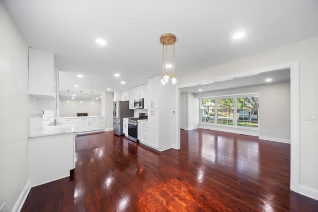 a view of kitchen with furniture and wooden floor