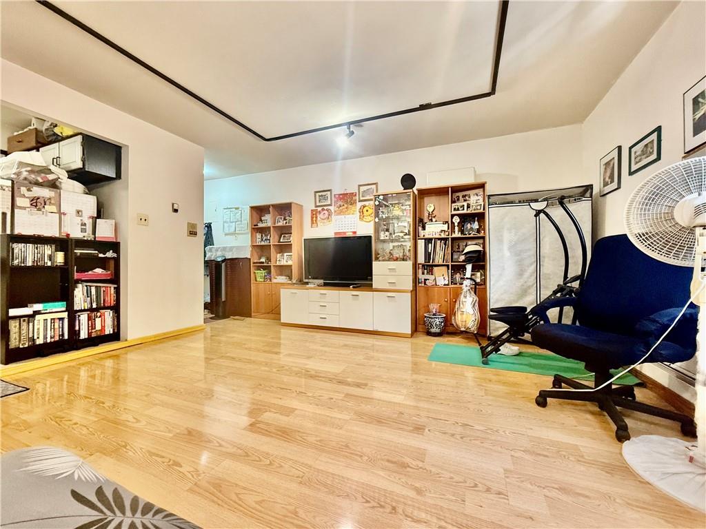 1348 63rd Street, Unit 5 Brooklyn, NY 11219 - Photo 3 of 10 a view of a room with gym equipment