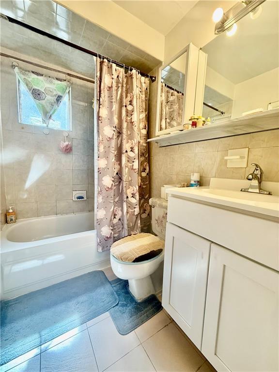 1348 63rd Street, Unit 5 Brooklyn, NY 11219 - Photo 8 of 10 a bathroom with a sink toilet and shower
