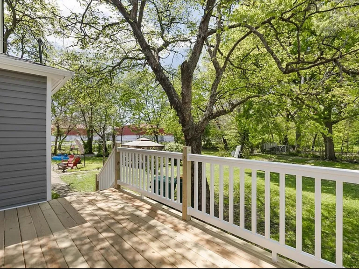 453 Water Street Joliet, IL 60436 - Photo 12 of 14 a view of a wooden deck and a backyard