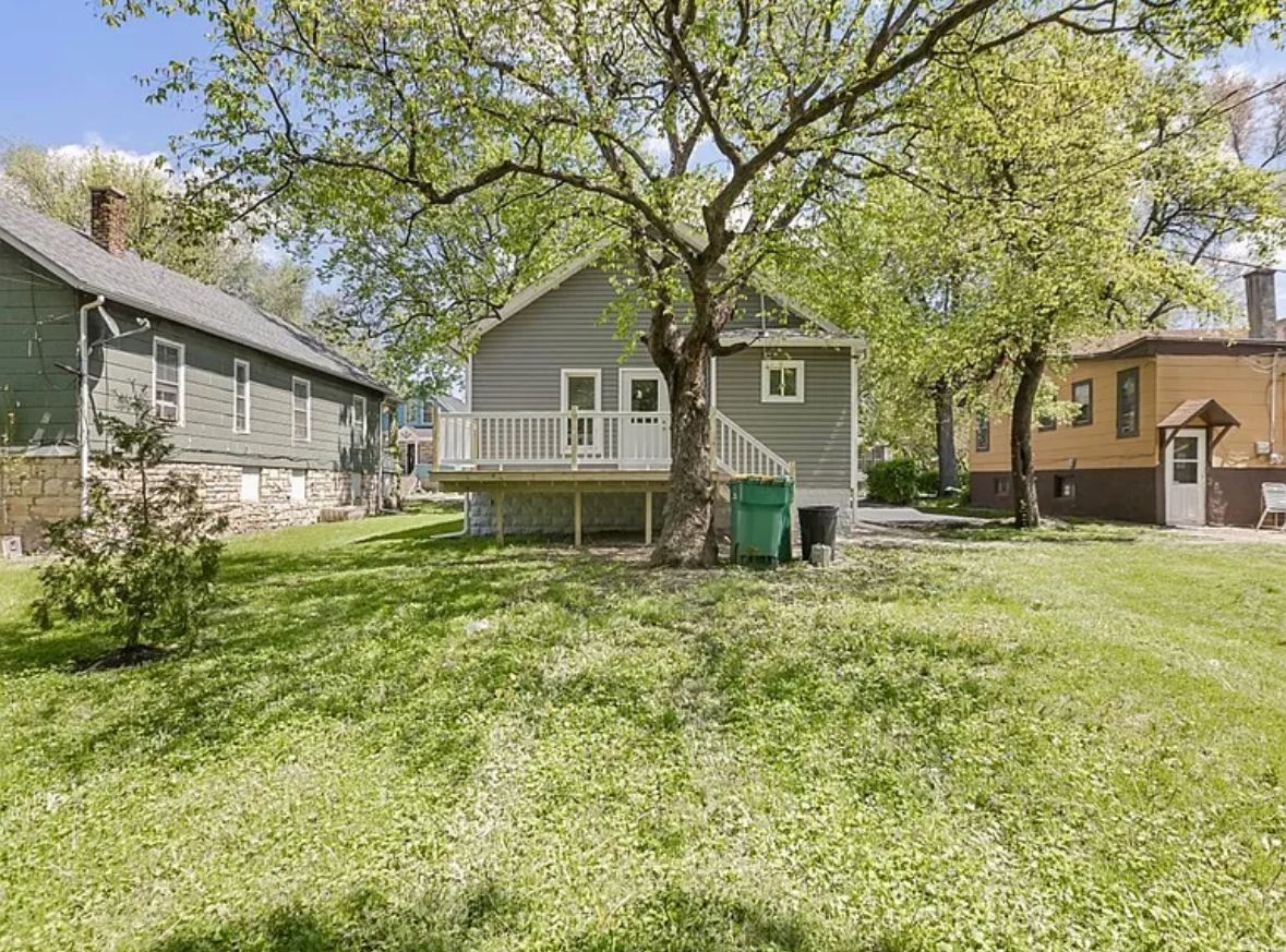 453 Water Street Joliet, IL 60436 - Photo 14 of 14 a front view of a house with a garden