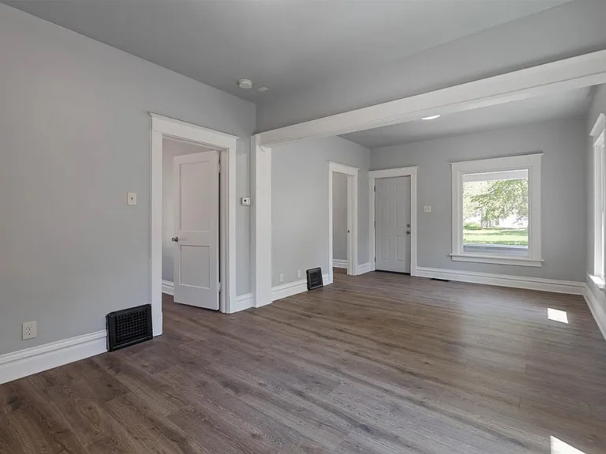 453 Water Street Joliet, IL 60436 - Photo 3 of 14 an empty room with wooden floor and windows