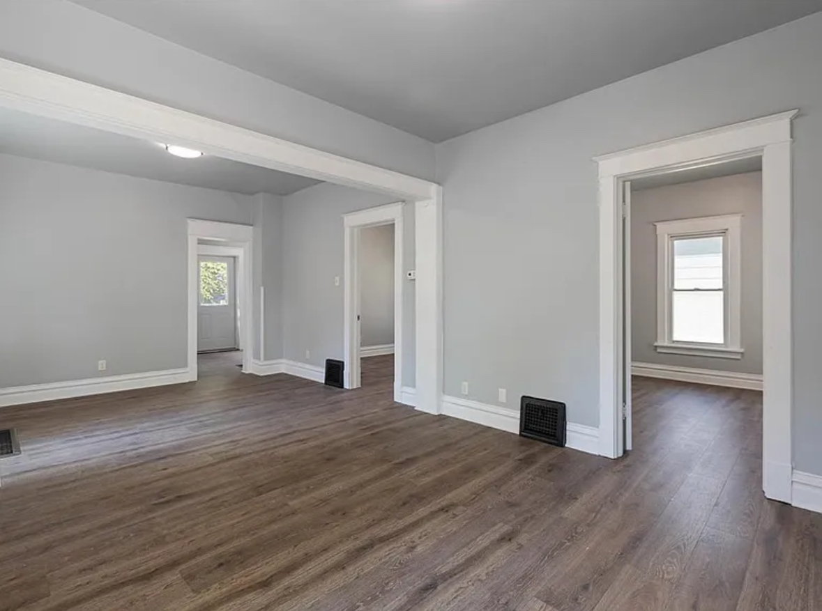 453 Water Street Joliet, IL 60436 - Photo 6 of 14 a view of empty room with wooden floor and fan