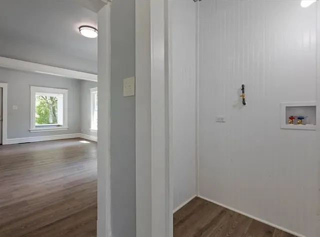 a view of empty room with closet and window