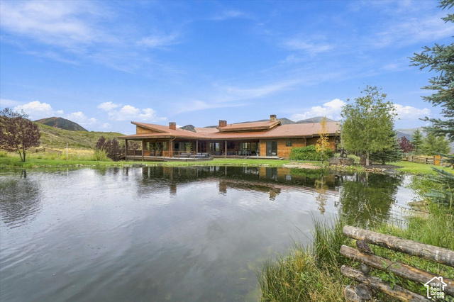 5936 Triple Crown Trail Oakley, UT 84055 - Photo 2 of 57 Expansive pond with a wooden fence