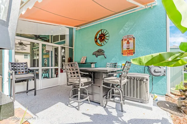 a view of a chairs and table in a patio