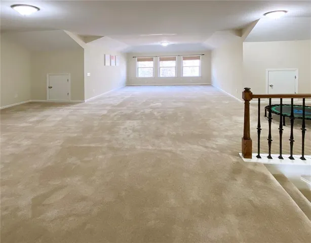 an aerial view of a house with a yard and garden