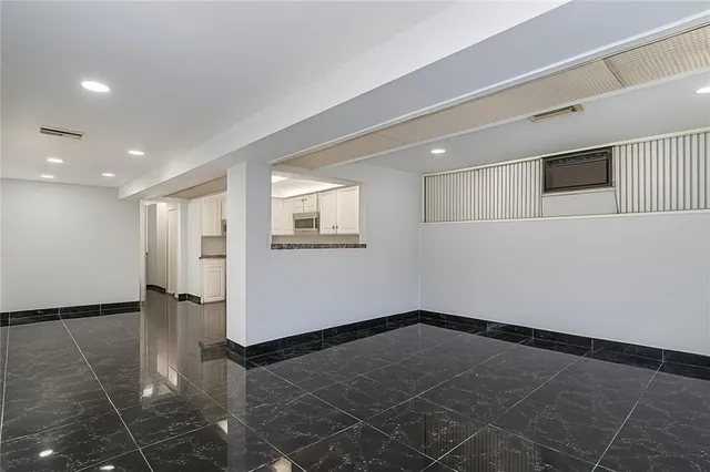 a view of a kitchen with a sink and an oven