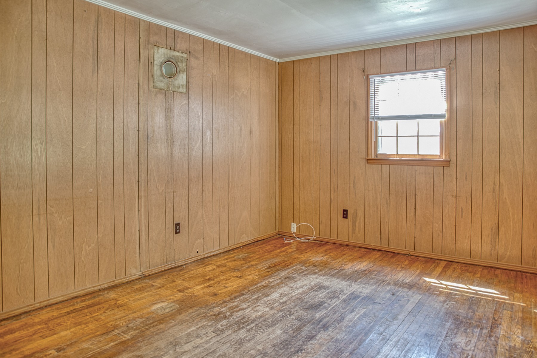 2110 Jr Camp Road Monterey, TN 38574 - Photo 30 of 35 an empty room with wooden floor and windows with curtains