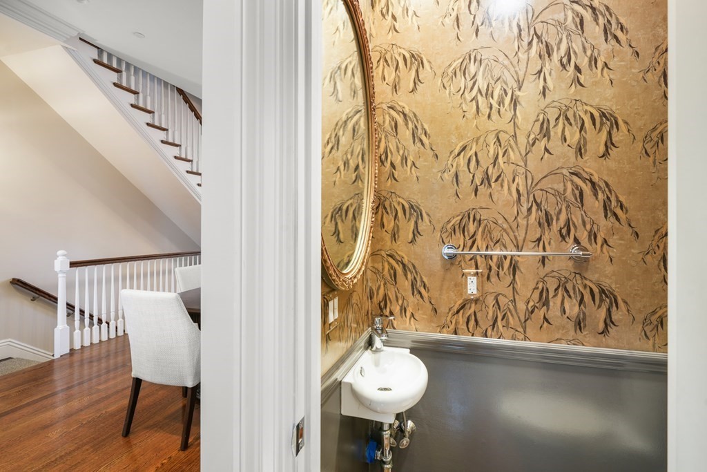 9 Columbus Square, Unit 2 Boston, MA 02116 - Photo 13 of 42 a view of a door and chair in wooden floor